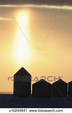 Stock Image -  winter granaries sunset grain storage canada. Fotosearch