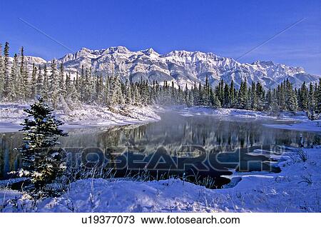 Stock Image -  winter landscape snowcapped miette mountain day. Fotosearch