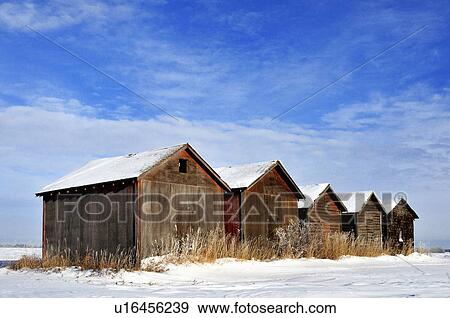winter scenic line old type grain storage sheds View Large Photo Image Stock Photo - winter scenic line old type grain storage sheds. Fotosearch