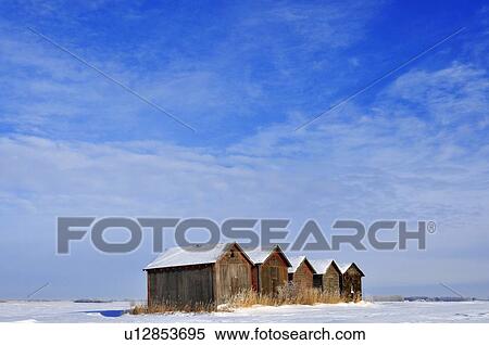 winter scenic line old type grain storage sheds View Large Photo Image Stock Photography - winter scenic line old type grain storage sheds. Fotosearch