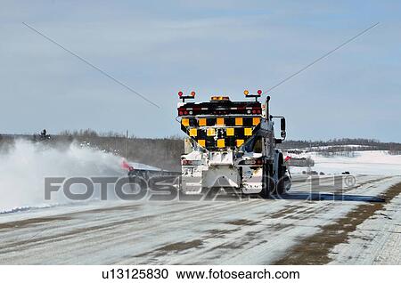 Stock Image -  winter travel image showing rear end truck snow. Fotosearch