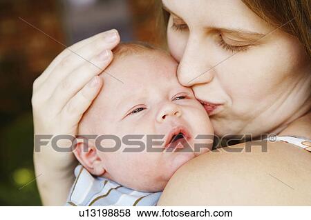 woman baby closeup young kissing son 12-15 months View Large Photo Image Stock Photo - woman baby closeup young kissing son 12-15 months. Fotosearch