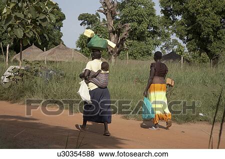woman baby women south sudan carrying items head View Large Photo Image Stock Photo - woman baby women south sudan carrying items head . Fotosearch
