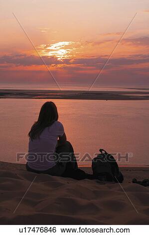woman beach water person sun backpacker watching View Large Photo Image Stock Photograph - woman beach water person sun backpacker watching. Fotosearch