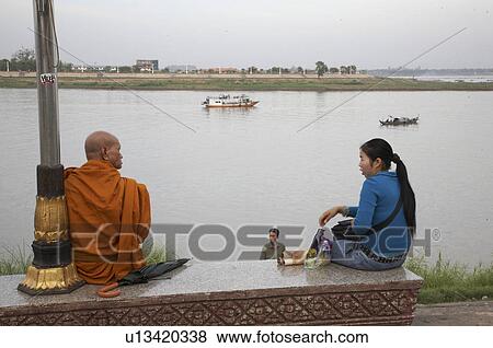 Stock Photo -  woman cambodia scene mekong river waterfront . Fotosearch