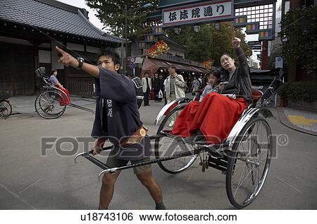 Stock Photograph -  woman child japan riding ricksahw in asakusa se . Fotosearch