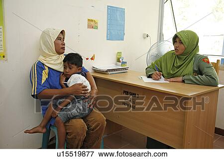 Stock Photo -  woman child women indonesia government health . Fotosearch