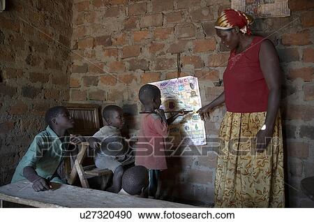Stock Image -  woman children home uganda in najjemba teopista . Fotosearch