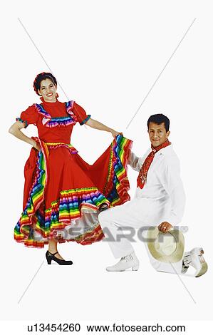 Stock Image -  woman couple man mid adult dancing young smiling. Fotosearch