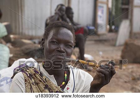 woman face women south sudan smoking pipe juba  View Large Photo Image Stock Image -  woman face women south sudan smoking pipe juba . Fotosearch