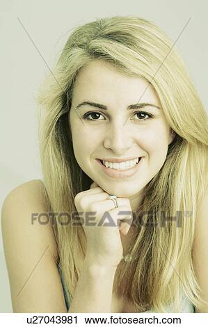 Stock Image -  woman fashion hand beauty portrait young smiling. Fotosearch