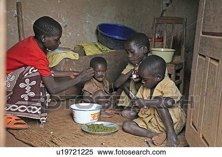 Stock Photography -  woman food child children burundi feeding gitera . Fotosearch