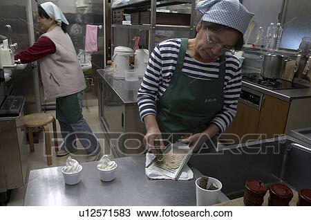 Stock Image -  woman food japan izu peninsular grating wasabi . Fotosearch