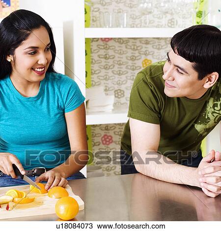 woman food man fruit young cutting orange 20-24 View Large Photo Image Stock Image - woman food man fruit young cutting orange 20-24. Fotosearch