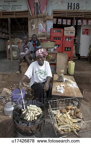 Stock Photo -  woman food uganda frying cassava nakifuma mukono . Fotosearch