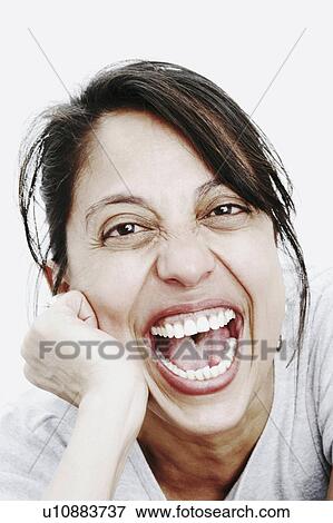 Stock Photo -  woman hand portrait mature laughing 40-44 years. Fotosearch