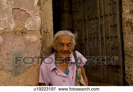 Stock Photo -  woman havana capitol city cuba local old in mr. Fotosearch
