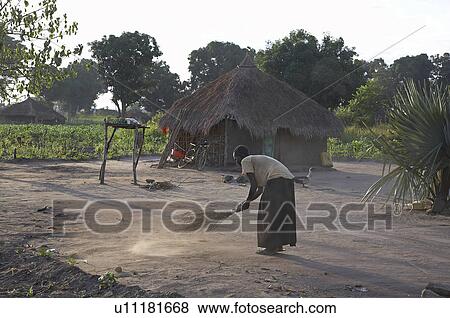 Stock Photo -  woman home women south sudan early morning scene . Fotosearch