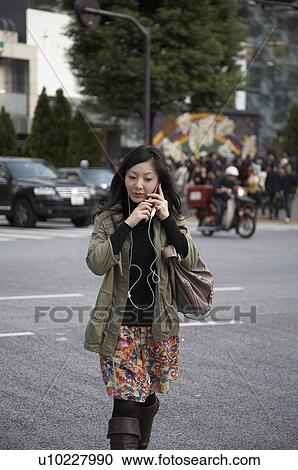 Stock Image -  woman japan shibuya tokyo cellphone asia se woman. Fotosearch