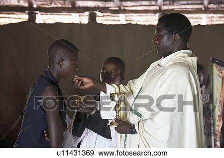 woman man women south sudan catholic mass in mud  View Large Photo Image Stock Photo -  woman man women south sudan catholic mass in mud . Fotosearch