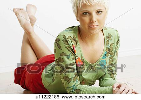 Stock Photograph -  woman pattern floral closeup young lying down. Fotosearch