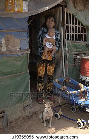 Stock Photography -  woman people house cambodia in front anlon knang . Fotosearch