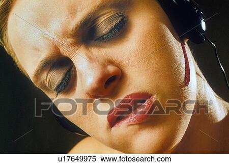 Stock Photography -  woman person face extreme expression wearing 1. Fotosearch