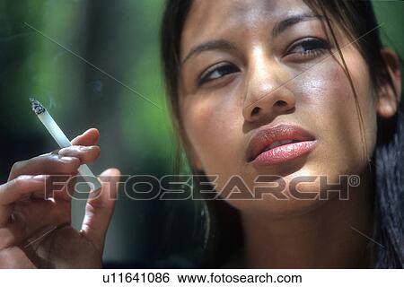woman person face latino smoking 20-25 years View Large Photo Image Stock Photograph - woman person face latino smoking 20-25 years. Fotosearch