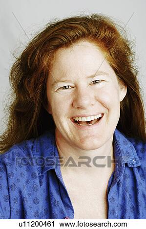 Stock Image -  woman portrait mature laughing 40-44 years blond. Fotosearch