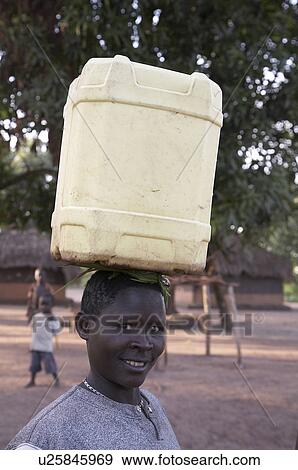 Stock Photo -  woman water hand women south sudan carrying pump . Fotosearch