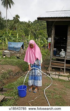 woman water women indonesia samsia collecting 2 View Large Photo Image Stock Photography - woman water women indonesia samsia collecting 2 . Fotosearch