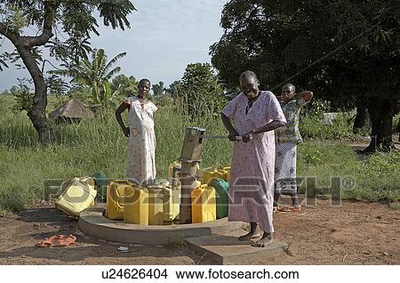 Picture -  woman water women south sudan pumping yei . Fotosearch