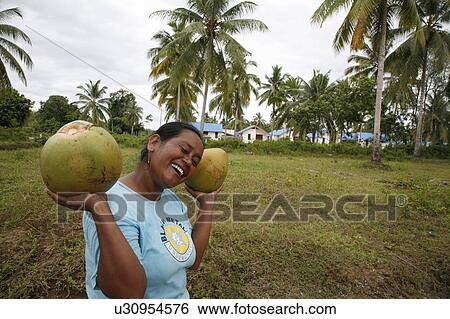 Stock Photograph -  woman women indonesia crs housing project site . Fotosearch