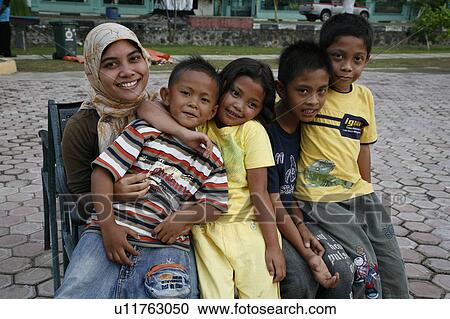 Stock Image -  woman women indonesia new municipal park built 2 . Fotosearch