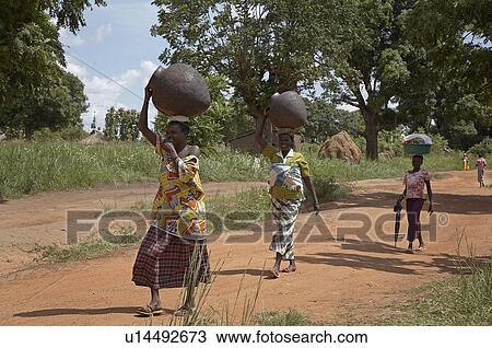 woman women south sudan carrying pots yei  View Large Photo Image Stock Image -  woman women south sudan carrying pots yei . Fotosearch
