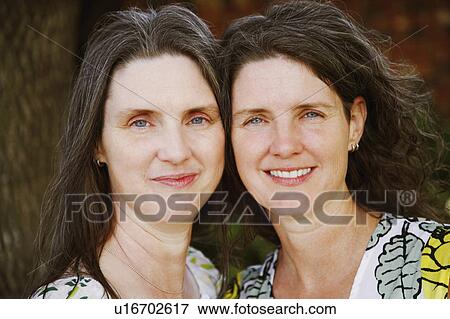 Stock Photo -  women portrait two mature smiling 45-49 years. Fotosearch
