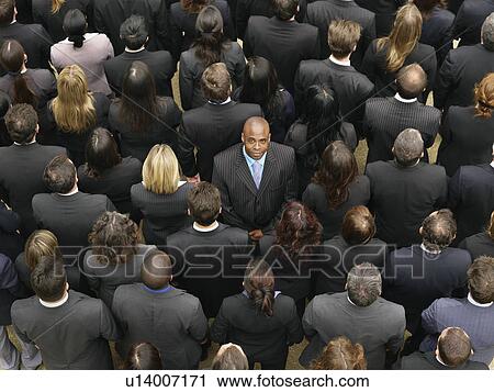 Back view of large group of business people, man facing opposite direction, elevated view View Large Photo Image Stock Image - Back view of large group of business people, man facing opposite direction, elevated view. Fotosearch