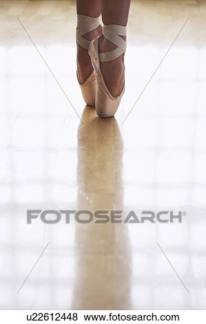 Stock Photo - Ballerina Standing en Pointe. Fotosearch
