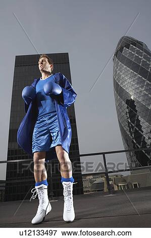 Boxer skipping on downtown rooftop, low angle view, London, England View Large Photo Image Stock Photo - Boxer skipping on downtown rooftop, low angle view, London, England. Fotosearch