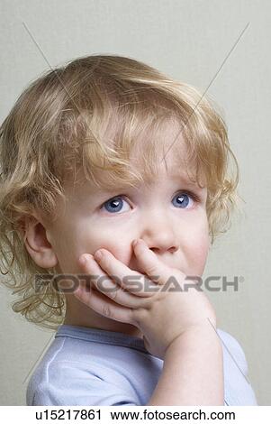 Boy (1-2 years) with hand on chin View Large Photo Image Stock Image - Boy (1-2 years) with hand on chin. Fotosearch