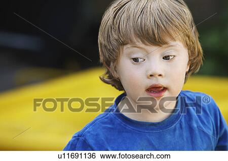 Boy (5-6) with Down syndrome View Large Photo Image Stock Photograph - Boy (5-6) with Down syndrome. Fotosearch