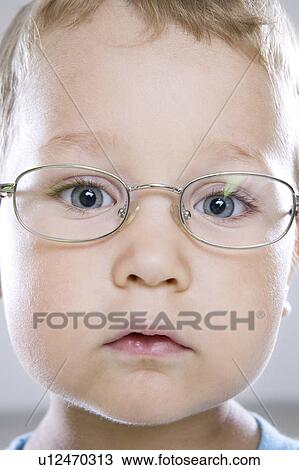 Stock Image - Boy in glasses, close-up. Fotosearch