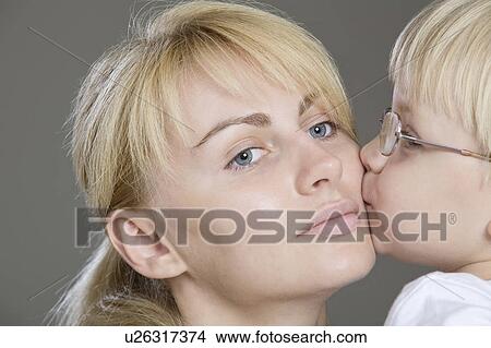 Picture - Boy Kissing His Mother, Close-Up, Studio Shot. Fotosearch