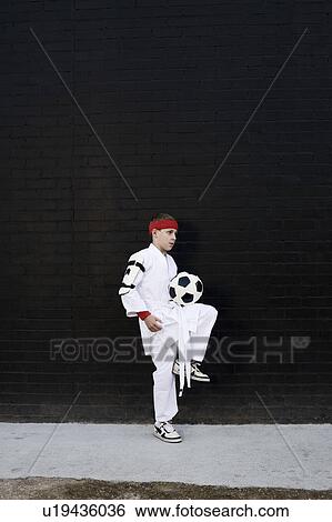 Boy wearing kimono with football View Large Photo Image Stock Photograph - Boy wearing kimono with football. Fotosearch