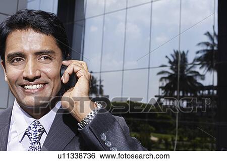 Business man smiling outdoors View Large Photo Image Stock Photograph - Business man smiling outdoors. Fotosearch