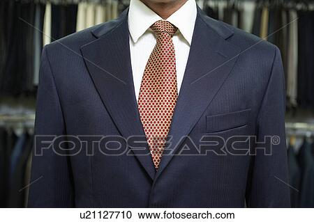 Business man standing in tailor's shop, mid section, close up View Large Photo Image Stock Image - Business man standing in tailor's shop, mid section, close up. Fotosearch