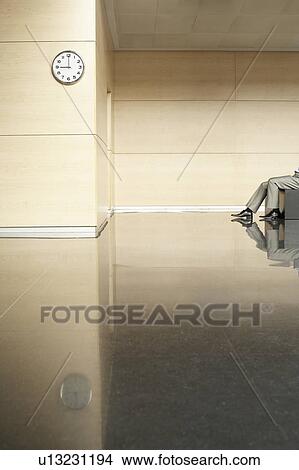 Businessman Sitting in Empty Hallway, low section View Large Photo Image Picture - Businessman Sitting in Empty Hallway, low section. Fotosearch