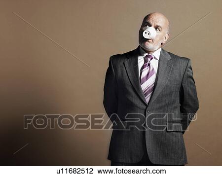 Businessman Wearing Plastic Cup as Pig Snout, half length View Large Photo Image Stock Image - Businessman Wearing Plastic Cup as Pig Snout, half length. Fotosearch