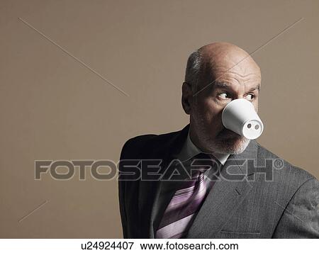 Businessman Wearing Plastic Cup as Pig Snout View Large Photo Image Stock Photo - Businessman Wearing Plastic Cup as Pig Snout. Fotosearch