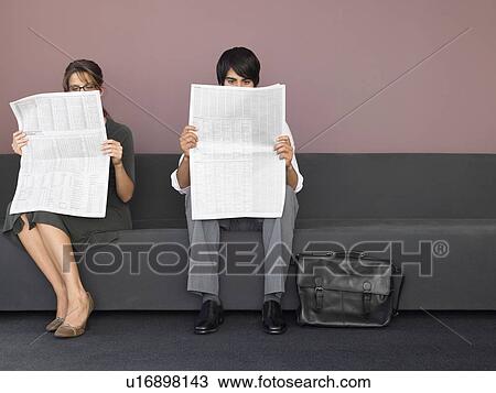Businesswoman and Businessman Reading Newspapers View Large Photo Image Stock Image - Businesswoman and Businessman Reading Newspapers. Fotosearch